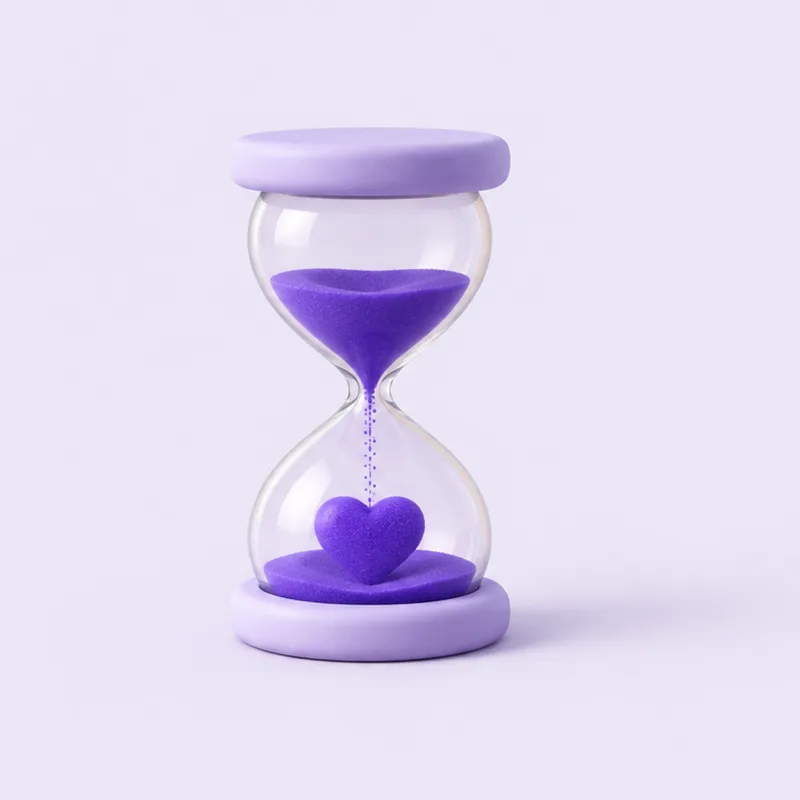 An hourglass whose violet sand settles into a heart