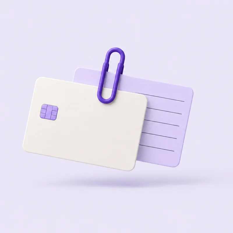 A payment card clipped to an appointment card with a violet paper clip